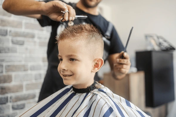 Child getting a neat haircut